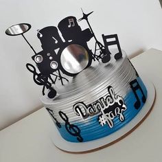 a birthday cake decorated with musical instruments and music notes