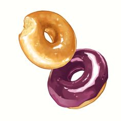 two donuts with purple and gold icing on them are sitting next to each other