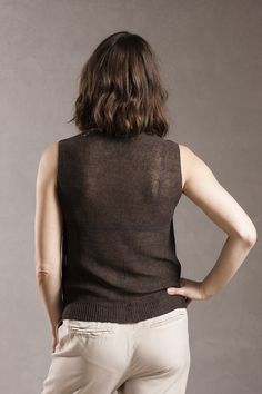 * Sleeveless top with V neck knitted of 100% pure linen yarn. * Crocheted edges at back neckline and armholes. Rib at bottom hem. * Slightly transparent. * Normal fit. Sizing: Model is 170 cm/5'6 tall and wears size M. Size XS (US 2-4, EU 32-34, UK 6): Width 40 cm / 15.8 in Length 55 cm / 21.3 in Size S (US 6, EU 36, UK 8): Width 42 cm / 16.5 in Length 56.5 cm / 22 in Size M (US 8, EU 38, UK 10): Width 45 cm / 17.7 in Length 58.5 cm / 22.9 in Size L (US 10, EU 40-42, UK 12): Width 48 cm / 18.9 i Elegant Sleeveless Linen Tank Top, Sleeveless Linen Top With Buttons, Beige Linen Sleeveless Tank Top, Black Linen Sleeveless Tank Top, Linen T Shirt, Roll Neck Jumper Dress, Soft Wool Sweater, Chic Linen V-neck Tank Top, Tweed Sweater