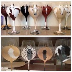 there are many wine glasses that have different designs on each glass and one has a horse head painted on it