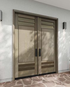 two brown doors on the side of a white building with stone flooring and windows