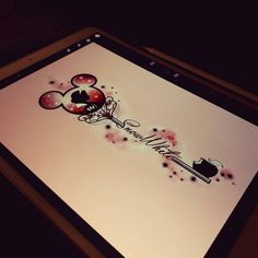 an ipad with mickey mouse stickers on it's screen and the word minnie written in black ink