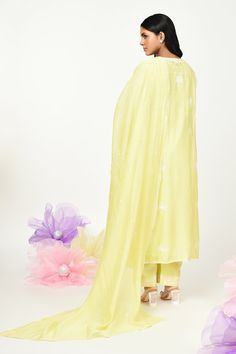 Yellow chanderi kurta with thread embroidery in floral placement pattern. Paired with cotton pant, inner and dupatta.
Components: 4
Pattern: Embroidery
Type Of Work: Thread, floral
Neckline: Round
Sleeve Type: Three quarter
Fabric: Chanderi
Color: Yellow
Other Details: 
Front button detailing
Lace embellished border
Embroidery on pant hem
Note: Potli shown in the image is not for sale
Occasion: Puja - Aza Fashions Cotton Sharara With Sheer Dupatta For Festivals, Festive Cotton Palazzo Set With Sheer Dupatta, Spring Straight Kurta Sets With Dupatta, Spring Sets With Straight Kurta And Dupatta, Spring Mulmul Sharara With Straight Kurta, Cotton Sharara With Sheer Dupatta For Eid, Cotton Sets With Sheer Dupatta For Navratri, Spring Chanderi Palazzo Set With Straight Kurta, Designer Cotton Palazzo Set With Sheer Dupatta