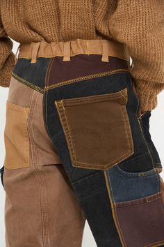 Brown Jeans With Patch Pockets For Fall, Recycled Denim Jeans With Patch Pockets For Fall, Brown Utility Jeans With Patch Pockets, Brown Cargo Pocket Denim Jeans, Brown Denim Jeans With Cargo Pockets, Streetwear Rigid Denim Bottoms With Patchwork, Rigid Denim Patchwork Bottoms For Streetwear, Brown Utility Denim Jeans, Brown Patchwork Straight Leg Bottoms