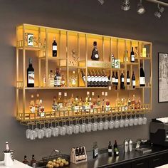 a bar with lots of bottles and glasses on it