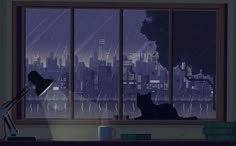 a cat is sitting in the window sill looking out at the city outside it