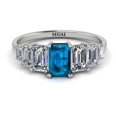 Bring something fresh and new into your style with this Emerald Cut Blue Topaz Geometric Ring. This ring is a charming band with a center emerald cut Blue Topaz and three more emeralds cut stones in each side of it. With this Emerald Cut Blue Topaz Geometric Ring, you get a ring with both luxury and style. Stock Number: 9086Blue Topaz Metal Setting Metal Type: 14K White Gold Main Stone Type: 100% Natural Blue Topaz Size: 0.56Ct / 6 x 4mm Shape: Emerald Cut Color: Blue Clarity: VS Additional Ston Geometric Ring, Conflict Free Diamonds, Cut And Color, Emerald Cut, Blue Topaz, Types Of Metal, Topaz, Emerald, Color Blue