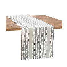 Give your table a seasonal refresh with this Slate Warner Striped Table Runner. Its bright, beautiful hues are sure to energize your kitchen or dining room! Runner measures 72L x14H in. Crafted of cotton Features a decorative stripe pattern Reversible design Hues of gray and white Hand crafted Care: Machine washable. This item is available at Kirklands.com only, not available in stores. Please note: this item cannot be shipped to APO/FPO addresses. | Slate Warner Striped Table Runner, Gray/White, 72L x14H , Cotton | Kirkland's Home Reversible Table Runner, Striped Table Runner, Striped Table, Cottage Ideas, Rectangle Table, House Things, Linen Table Runner, Dining Linens, Outdoor Ottoman