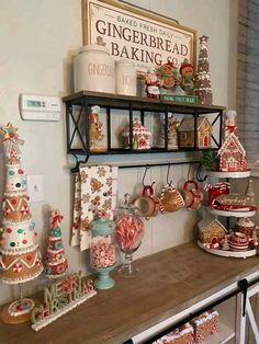 a shelf filled with lots of candy and christmas decorations on top of a wooden table