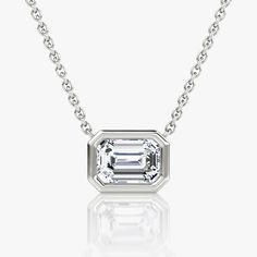 The Bezel Solitaire Necklace combines vintage-inspired detail and modern appeal together for a look that’s timelessly elegant. Timeless Platinum Jewelry In White Gold, Timeless White Gold And Platinum Jewelry, Timeless Platinum White Gold Jewelry, 14k White Gold Jewelry With Bezel Setting, Timeless Platinum Jewelry For Anniversary, Classic Sterling Silver Diamond Necklace With Bezel Setting, Classic Platinum Diamond Necklace With Bezel Setting, Classic Platinum Necklace With Bezel Setting, Timeless Emerald Cut Solitaire Necklace With Diamond Accents