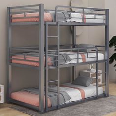 a bunk bed with two sets of mattresses on the bottom and one set of drawers below