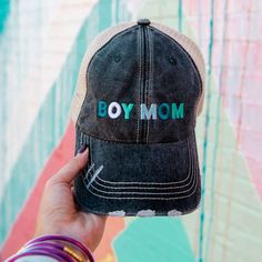 Stylish Mom Caps Looking for mom caps your customers are sure to love? Whether your customers are heading to the ball game to watch their sons hit a home run or running errands with their younger boys, our sturdy and stylish “Boy Mom” hats are the perfect finishing touch to any casual outfit. Help your customers express their mama pride with these unique, multicolored women’s trucker hats. designed by our fashion-forward team trucker caps with long-lasting embroidery curved bills for UV protecti Customizable Black Hats For Baseball Season, Fun Black Hat For Sports, Fun Black Sports Hat, Black Fun Sports Hat, Fun Black Baseball Cap With Letter Print, Casual Customizable Trucker Hat For Baseball Season, Casual Customizable Trucker Visor Hat, Casual Black Customizable Baseball Cap, Casual Black Customizable Trucker Hat