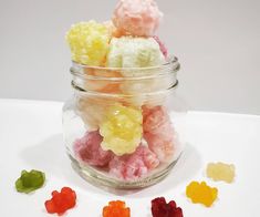 several gummy bears are in a glass jar