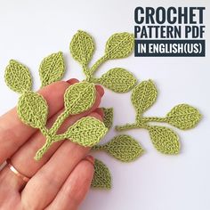 the crochet pattern is in english and has green leaves