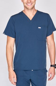 Double pocket men's performance scrub top with a modern, streamlined look. Four-way stretch and moisture-wicking fabric keep you comfortable. Cargo Scrub Pants, Cairo, Design Modern