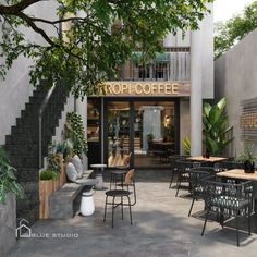 an outdoor cafe with tables, chairs and plants on the outside wall that says top coffee