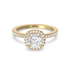 a yellow gold engagement ring with a round diamond center