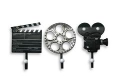 three movie reels and a camera on a white background