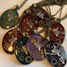 an assortment of necklaces with different designs on them