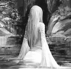 a black and white photo of a woman with long hair standing in front of a waterfall