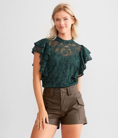 Red By BKE Floral Lace Flutter Top - Green Small, Women's Junglegreen Fabric lined top Back button keyhole detail Bust measures 32 on size small Body length 22 on size small. Self: 93% Nylon 7% Spandex. Lining: 100% Polyester. Machine wash cold delicate cycle. Do not bleach. Lay flat to dry. Do not iron.. Measurements: Bust -Fullest part of bust with arms at sides. Waist -Circumference of natural waist: above belly button below rib cage. Hips -Standing with feet together fullest part of hips. WO Jungle Green, Women Shirts Blouse, Rib Cage, Shirts Blouses, Women's Shirts, Red Blouses, Belly Button, Floral Lace, Fabric Care