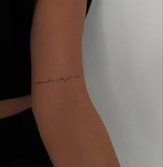 a woman with a tattoo on her arm