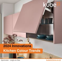 a kitchen with pink cupboards and white walls in the background is an advertisement for kube