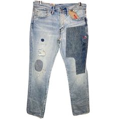 a pair of jeans with holes and patches on them