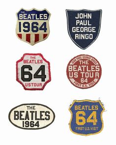 the beatles badges are all in different colors and sizes, including red, white, blue, and yellow