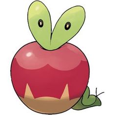 an apple sitting on the ground with its eyes open