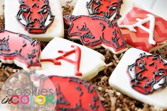 decorated cookies in the shape of football helmets