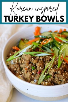 a white bowl filled with meat and veggies on top of a table next to a napkin