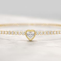 This exquisite 1.90 Carats Heart Cut Center Luxury Diamond Tennis Bracelet features lab-grown diamonds set in a delicate, thin stacking design. Crafted with elegance, this bracelet makes a perfect birthday present or meaningful gift for any occasion. Its heart-cut center stone adds a romantic touch to the timeless tennis bracelet, combining luxury with ethical craftsmanship for a truly stunning piece of jewelry. 𝐅𝐞𝐚𝐭𝐮𝐫𝐞𝐬: * 𝐌𝐚𝐝𝐞 𝐭𝐨 𝐎𝐫𝐝𝐞𝐫 * 𝐌𝐞𝐭𝐚𝐥: 𝟏𝟒𝐊 𝐆𝐨𝐥𝐝 | 𝟏𝟖𝐊 3 Carat Diamond, Diamond Tennis Bracelet, Luxury Diamonds, Tennis Bracelet Diamond, Perfect Birthday, Birthday Present, Tennis Bracelet, Conflict Free Diamonds, Bracelet Stack