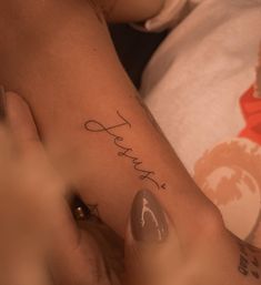 a woman's foot with the word hope tattooed on her left leg and hand