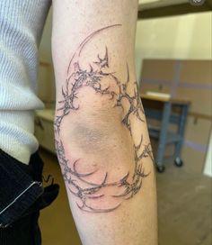 a person with a tattoo on their arm