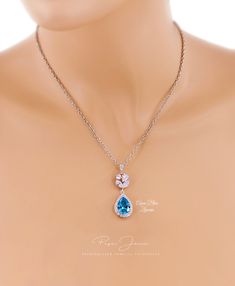 Finish: Silver Platinum or Rose gold plated Material: Top quality rhinestones,AAA Zirconia, lobster clasp, Platinum plated Rhinestone Bail. (Pic.10) Color of Teardrop: Navy Blue ,Peach Morganite ,Green Apple ,Aqua Blue or Clear Zirconia. Size of Teardrop: 19mm ~Necklace Length of Necklace: 17.5 inches We provided two backdrops for you to choose: 1) Style.A :with 7 inches teardrop AAA zirconia pendant backdrop 2) Style.B :with 6 inches teardrop AAA zirconia pendant backdrop 3) Style.G With 8 inch Sapphire Dangle Jewelry For Wedding, Sapphire Jewelry Sets For Wedding, Blue Drop Jewelry For Wedding, Blue Teardrop Jewelry For Wedding, Blue Teardrop Wedding Jewelry, Blue Dangle Necklaces For Wedding, Sapphire Cubic Zirconia Bridal Necklace Gift, Blue Pear-shaped Crystal Jewelry, Dainty Blue Necklace For Wedding