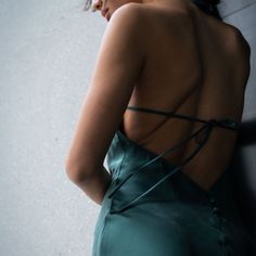 Discover opulence like never before with our Seren 100% Silk Open Back Halter Dress. This alluring mid-length dress features a sophisticated halter neck that elegantly ties at the back, accentuating the grace of the wearer's neck and shoulders. Designed to captivate, the open back charm is tastefully amplified by the silk button details adorning the lower back. The dress ties both at the neck and mid-back, allowing for a personalised fit and comfort without compromising on style. Crafted from the finest silk, this halter dress promises a smooth, luxurious feel against the skin, making it an unforgettable ensemble for any occasion. Step into the world of fashion grandeur with this timeless piece. Designed in Hong Kong Fits true to size Sand-Washed Mulberry Silk Small Batch Sustainable Finis Silk Halter Dress, French Seam, The Grace, Mid Length Dresses, Tie Dress, Small Batch, Independent Designers Fashion, Mulberry Silk, Lower Back