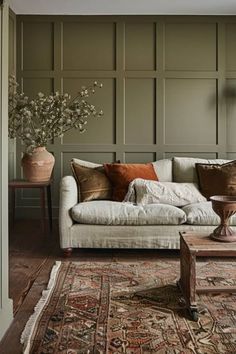 a living room filled with furniture and decor