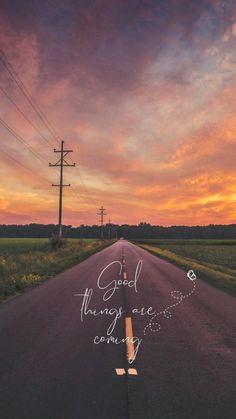 an empty road with the words good things come coming up on it at sunset or dawn