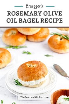 rosemary olive oil bagel recipe on a white plate with herbs and bread in the background