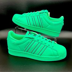 Adidas Original Men’s Superstar Gv9444 Sneakers Sz 8.5 Bold Adidas Superstar Shoes Made In Part With Recycled Content A Fixture On The Cultural Scene For More Than 50 Years, The Adidas Superstar Shoes Are One Of The Most Iconic Adidas Sneakers Ever Created. The Adidas Superstar ‘Hi-Res Green’ Transforms The Iconic Shell-Toed Silhouette With A Monochrome Finish In An Eye-Catching Emerald Hue. Made In Part With Recycled Content, The Leather Upper Features Contrasting Black Accents On The Sneaker’s Adidas Green Custom Sneakers For Sports, Adidas Green Sneakers With Breathable Toe, Adidas Green Sneakers With Perforated Toe Box, Adidas Custom Green Sporty Sneakers, Adidas Sporty Green Custom Sneakers, Sporty Green Adidas Custom Sneakers, Adidas Green Low-top Custom Sneakers, Japanese Lettering, Branding Elements