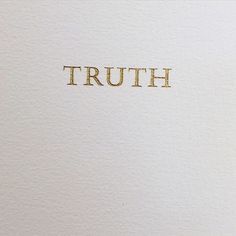 the word truth written in black ink on white paper