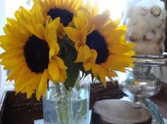 sunflowers are in a vase on a table