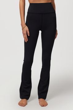 Supermodel status. A high-rise, body-hugging bootcut pant with a built-in hidden cell phone back pocket. Designed with our Dream Tech Eco Jersey that is compressive, moisture-wicking, quick-drying, and anti-odor. | Giselle Bootcut Pant in Black Black Mid-rise Yoga Pants For Fall, Versatile Straight Leg Yoga Pants For Fall, Straight Leg Athleisure Bottoms For Fall, Black Casual Yoga Pants With Minimal Stretch, Fall Athleisure Straight Leg Bottoms, Stretch Flare Jeans For Everyday, Stretch Full-length Elastane Flare Jeans, Stretch Full Length Flare Jeans, Comfort Stretch Mid-rise Yoga Pants