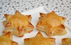 small star shaped pastries on a white plate