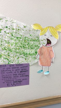 a child's artwork is displayed on the wall