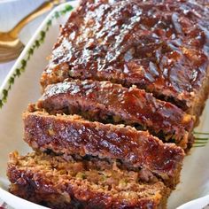 slices of meatloaf on a white platter