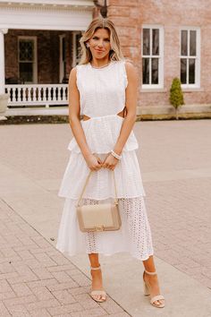 Show up and show out in our striking white 'Touch My Soul' midi dress featuring lightweight material with delicate eyelet detailing, a high neckline, wide sleeveless shoulder straps, ruffle trim detailing, accent side cutouts, and a tiered skirt silhouette that falls into a straight mid-calf length hemline! 
                                     Measurements S :  Bust 32", Hip 36", Length 45", Waist 28".  M :  Bust 34", Hip 38", Length 45.5", Waist 30".  L :  Bust 36", Hip 40", Length 46", Waist Model Fits, Touch Me, Women Clothing Boutique, Tiered Skirt, High Neckline, Show Up, Hip Length, Ruffle Trim, Online Womens Clothing