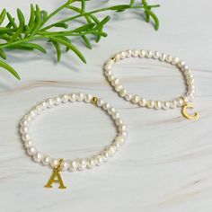 Adorn your wrist with a stylish Freshwater Pearl Initial Charm Bracelet. Featuring freshwater pearls and a clean font initial charm, this bracelet provides both timeless elegance and personalization.It makes the perfect gift for yourself or your loved ones and is suitable for everyday wear or special occasions. Stack it with other bracelets for a stunning layered look.Dimensions: approximately 6.5" before stretchGenuine freshwater pearls18k gold plated stainless steel initial charm with water and tarnish resistantEthically sourcedLead and Nickel freeMade In: ChinaMaterial Composition: 18k gold plated stainless steel, freshwater pearls