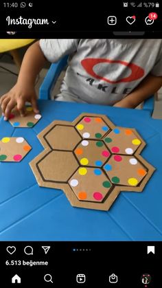 a child is playing with some sort of board game